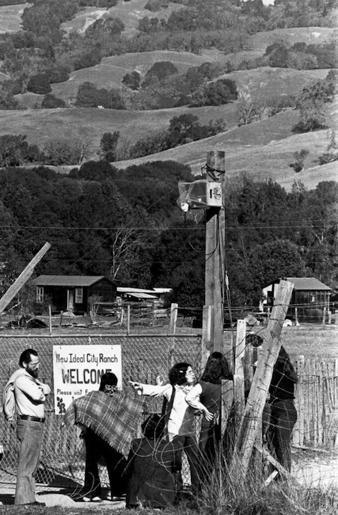 Visiting family members stand at entrance to New Ideal City Ranch, Boonville, California, April 4, 1977. (AP photo)